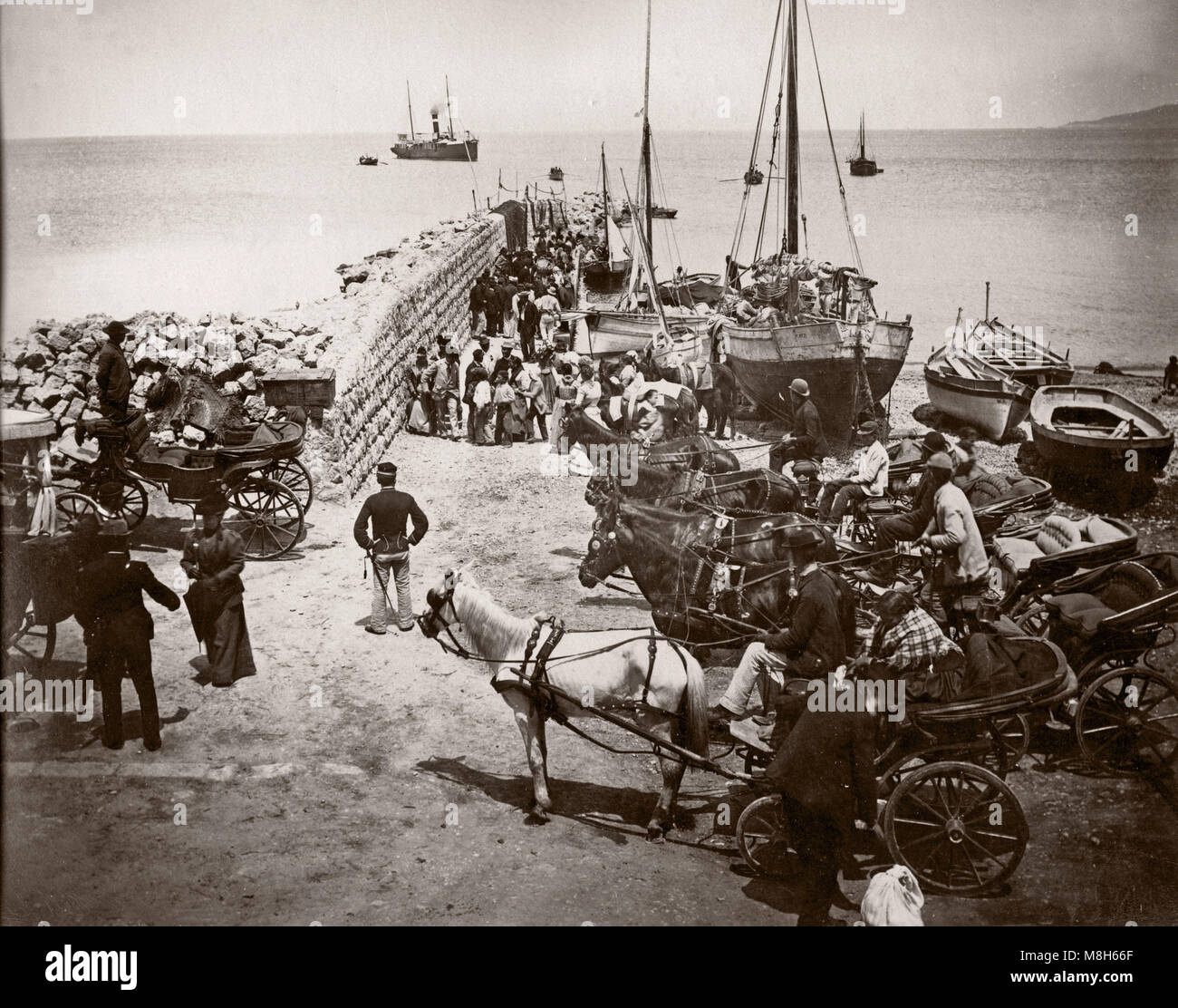 c.1880s Italy - harbour scene with hackney carriages and horse waiting for a ship - probably Naples or area Stock Photo