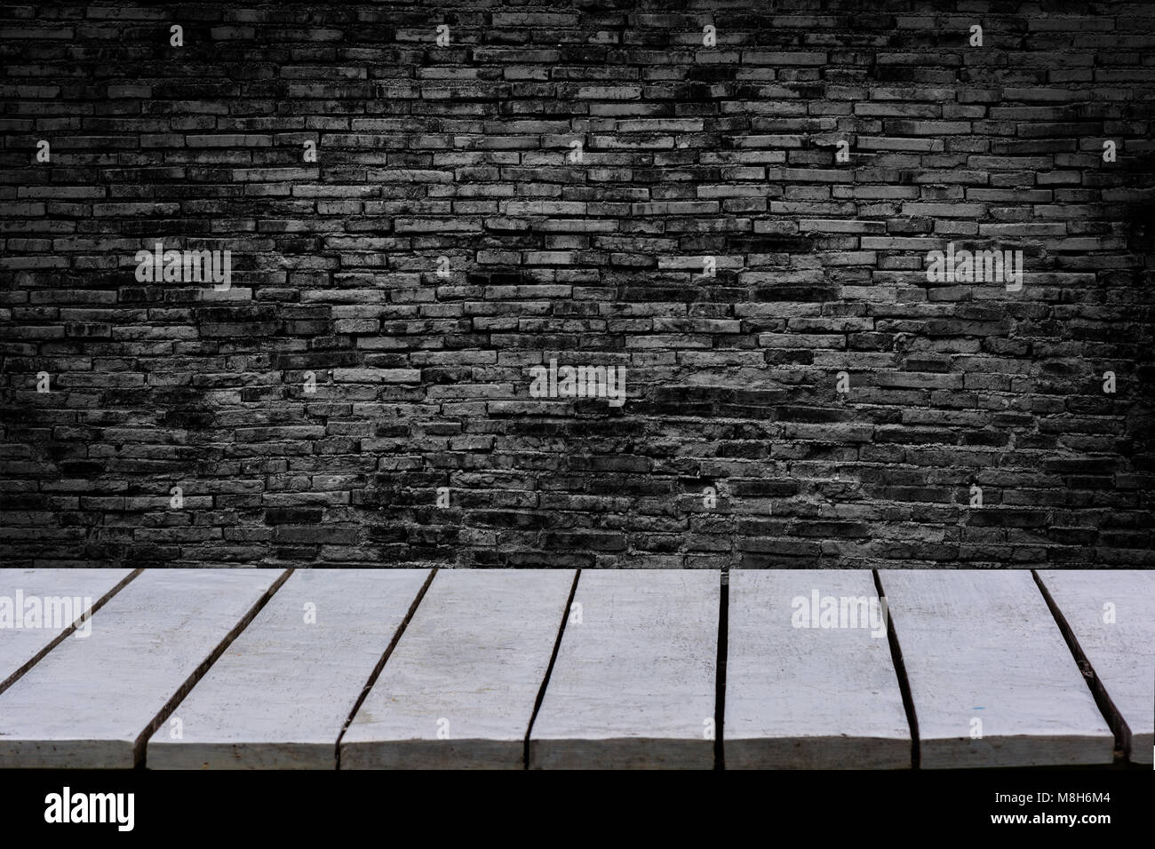 table empty The background is brick wall Empty top wooden shelves and stone wall background Stock Photo