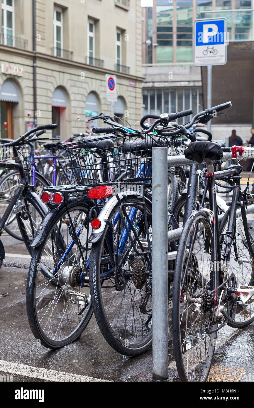 Bicycle parking in the city center of Bern, Switzerland - Stock Photo