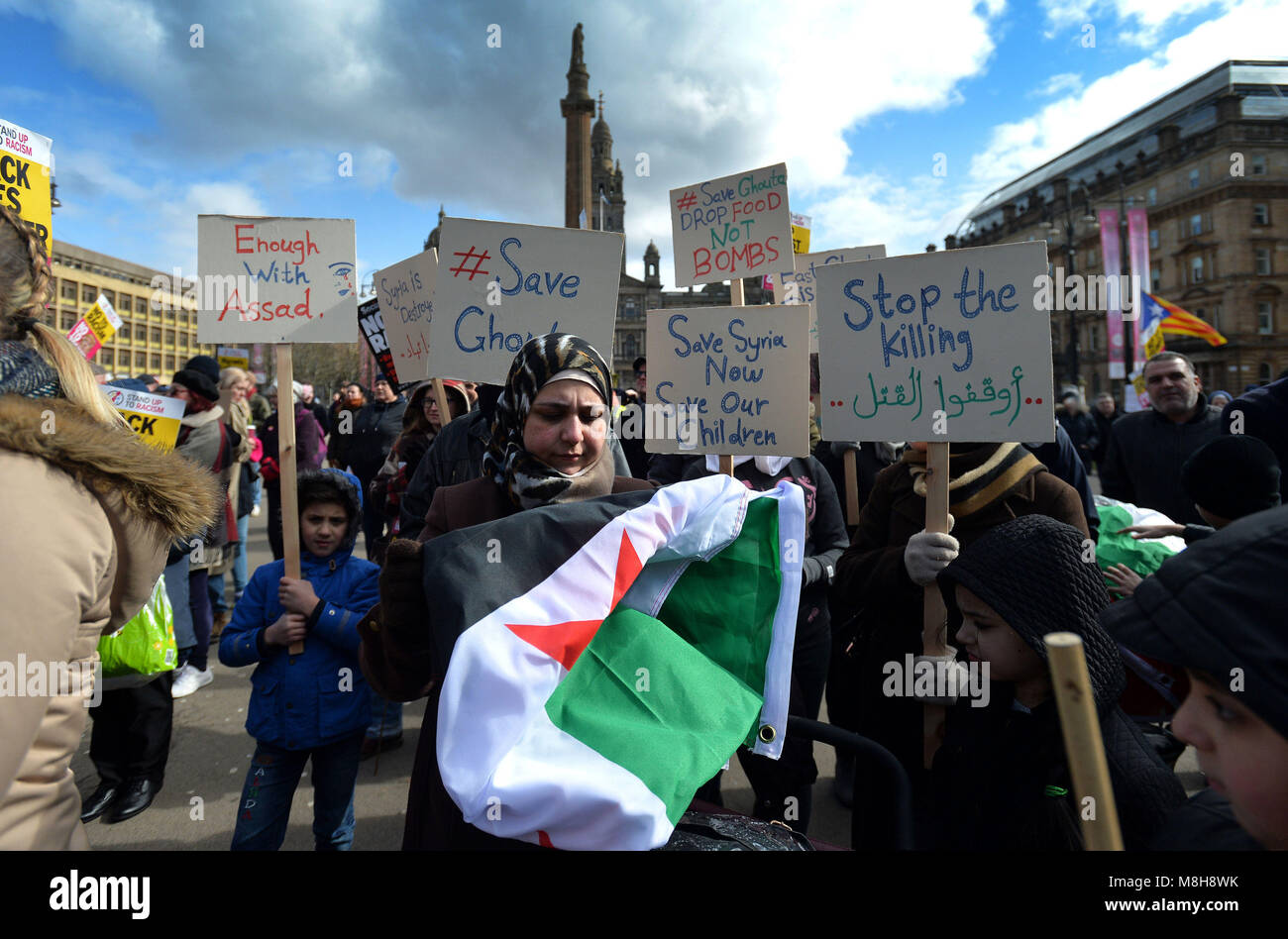 Marchers highlight the plight of civilians in Eastern Ghouta, Syria, during an anti-racism rally in Glasgow organised by Stand up to Racism Scotland. Stock Photo