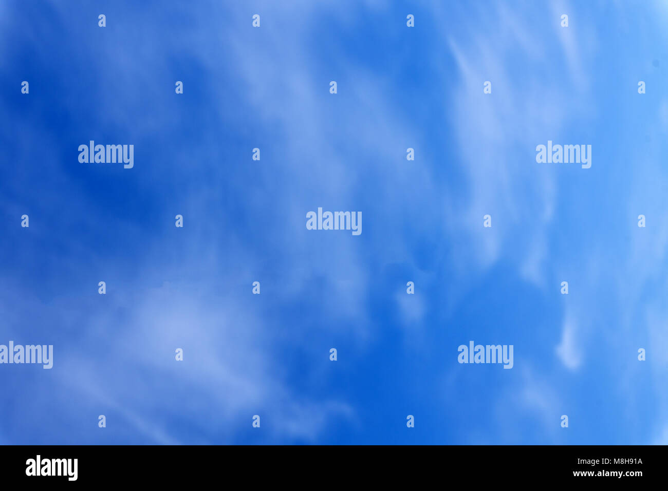 Matte white grey clouds in front of blue sky Stock Photo - Alamy