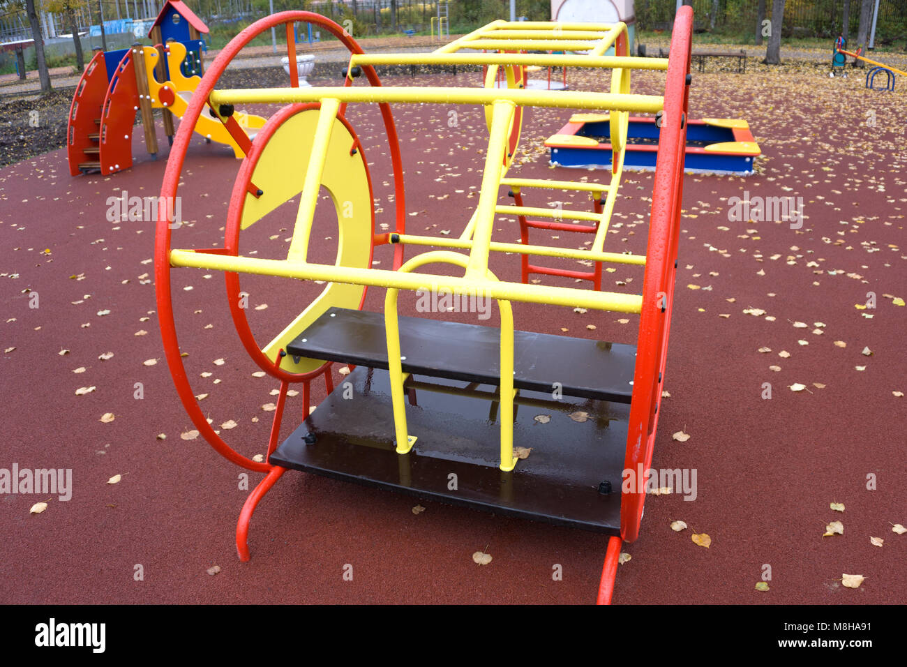 Teeter Totter, Player climbing, and others kids play equipment at