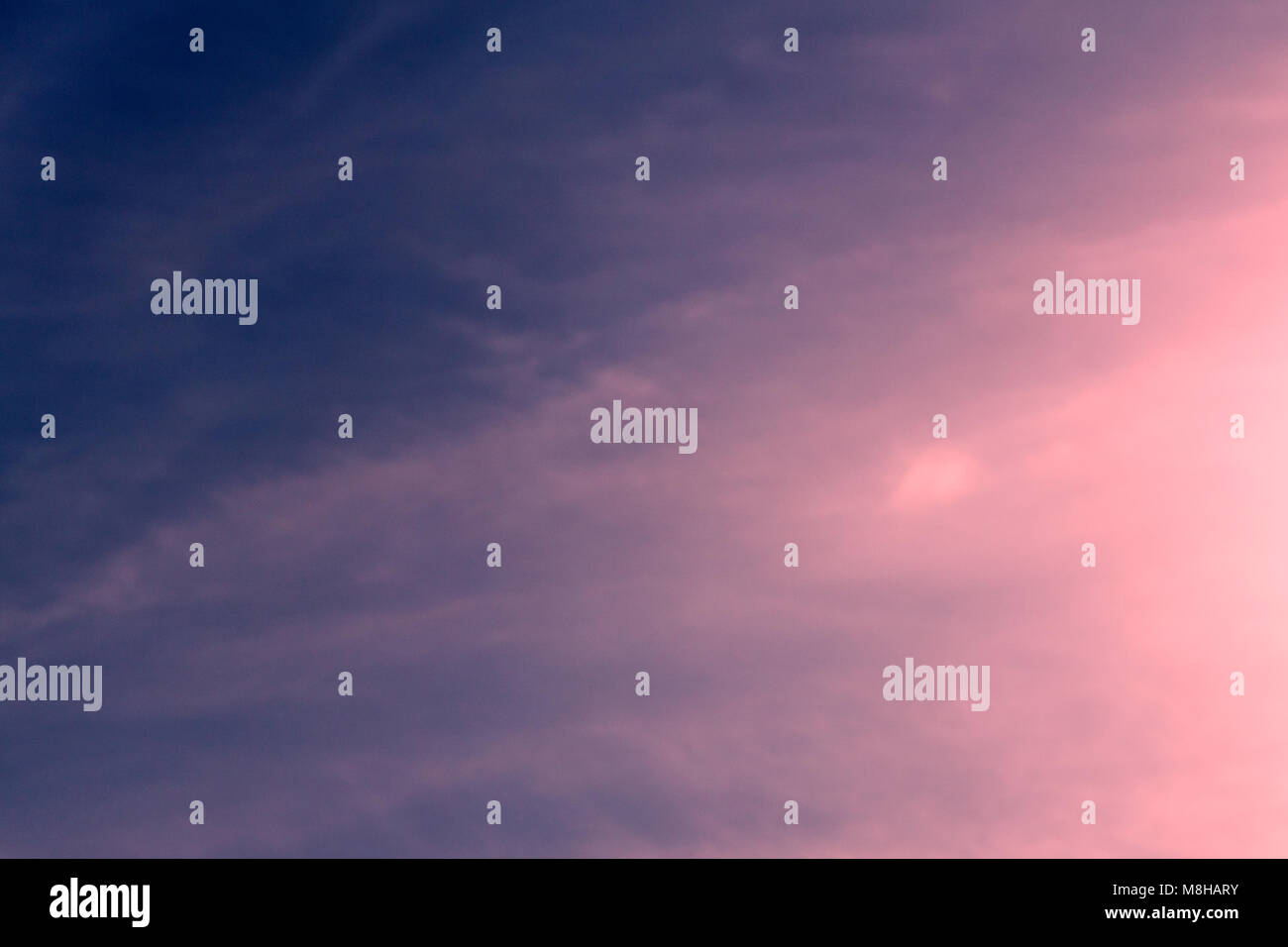 White curly clouds in a blue sky. Sky background Stock Photo - Alamy
