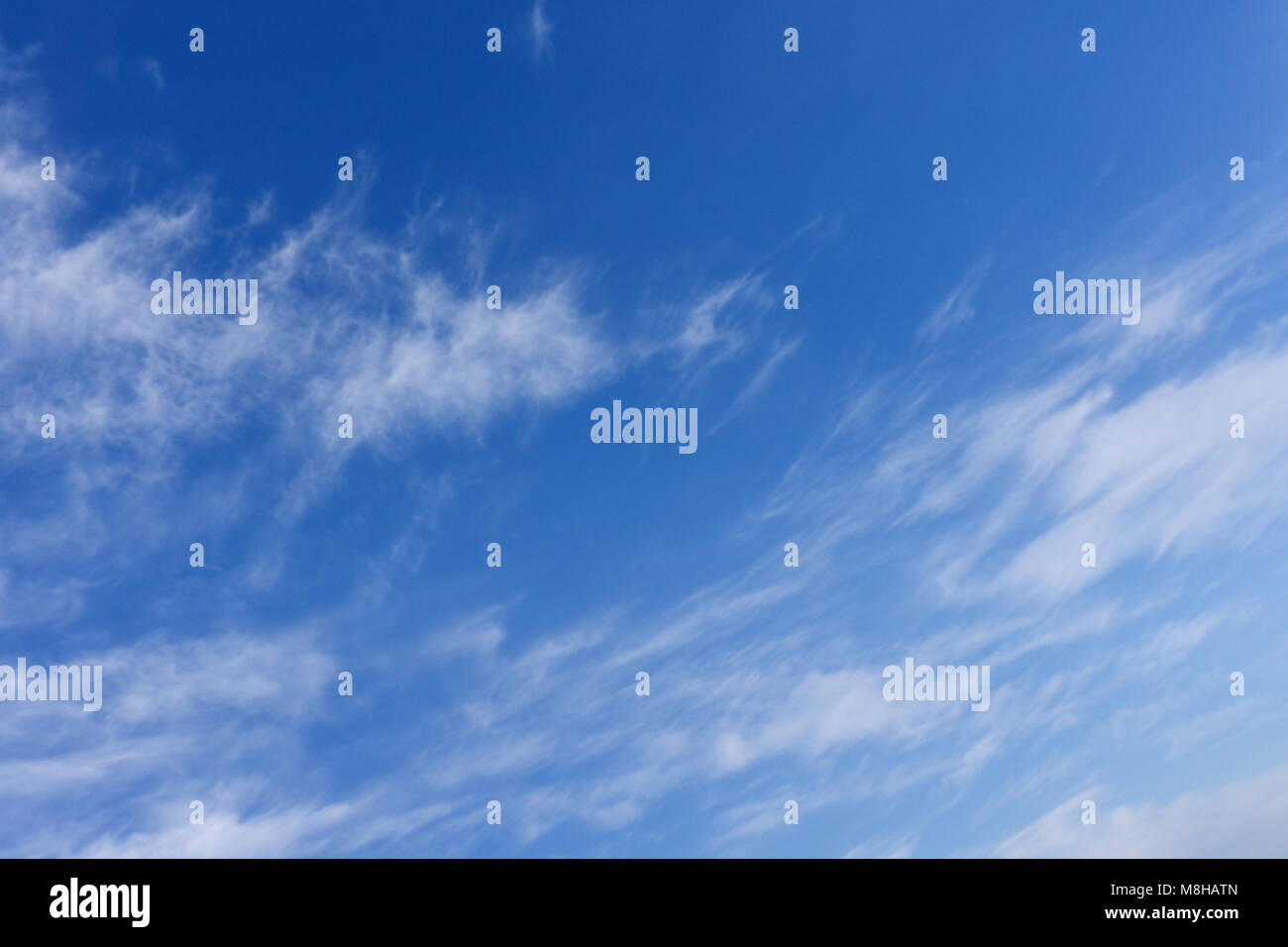 White cloud and blue sky. Above is blue azure, bottom bright cloud. Celestial dome is everything above surface Earth. Cloud is aerosol liquid droplets Stock Photo