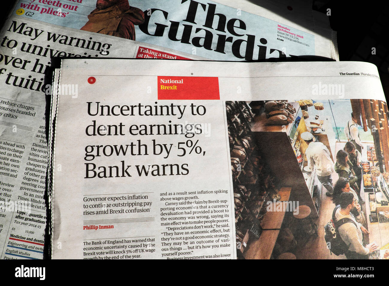Guardian Newspaper Article Headline Uncertainty To Dent Earnings Growth By 5 Bank Warns London England Uk Stock Photo Alamy