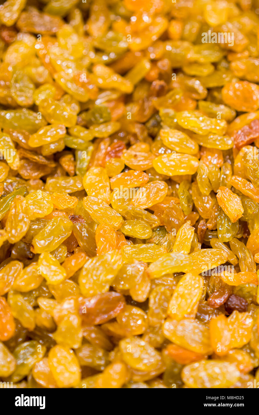 background of raisins in sale in the shop of dried fruit. Stock Photo