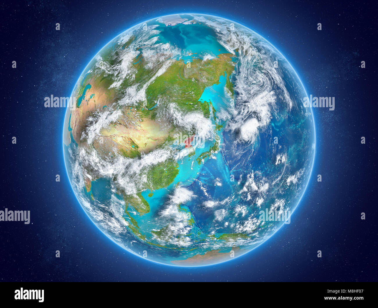 North Korea in red on model of planet Earth with clouds and atmosphere ...