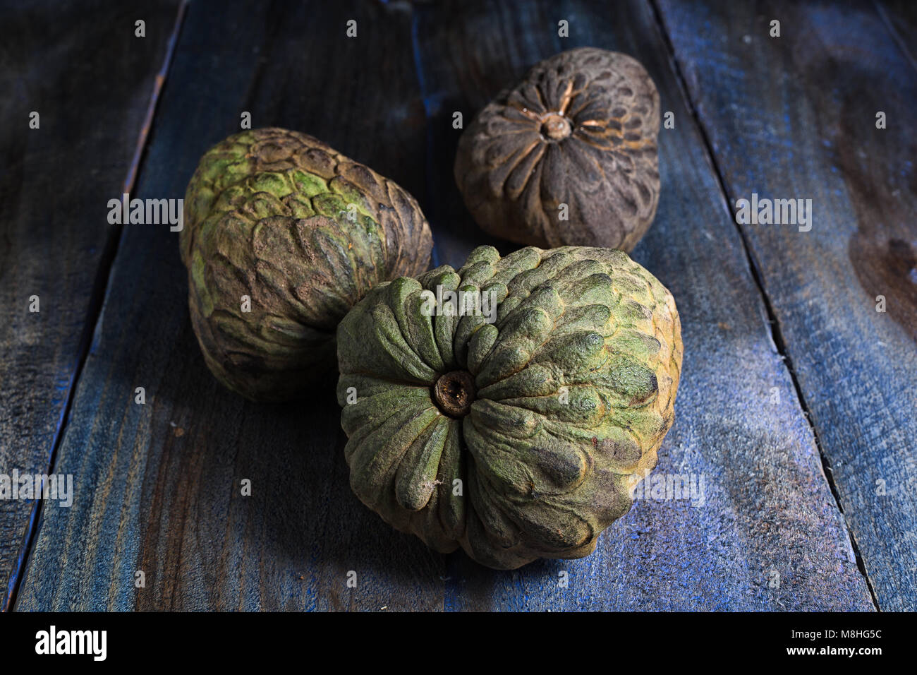 cherimoya fruits also known as custard apple on rustic background Stock Photo