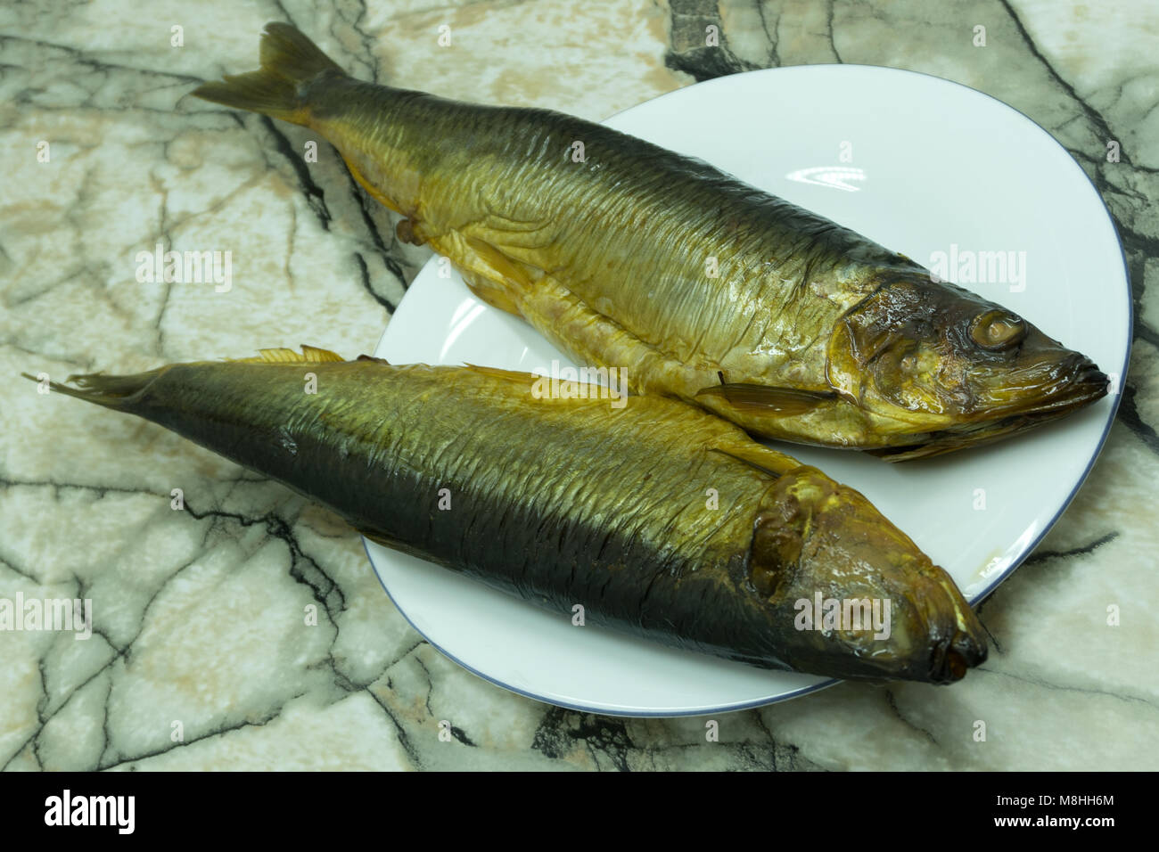 Herrings on net Pacific herring variety wooden Stock Photo Alamy