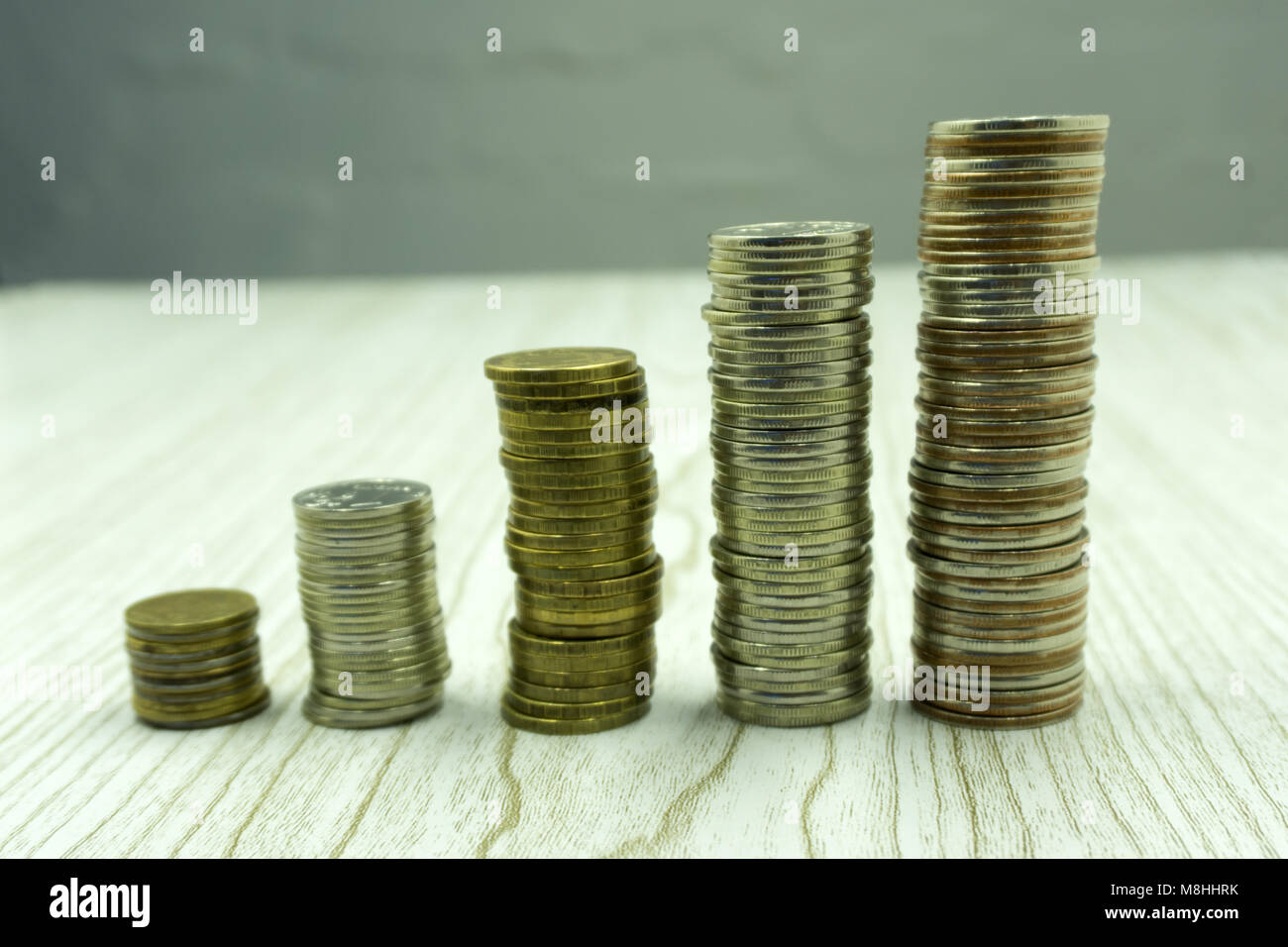 Stack of golden coins isolated on white background Stock Photo - Alamy
