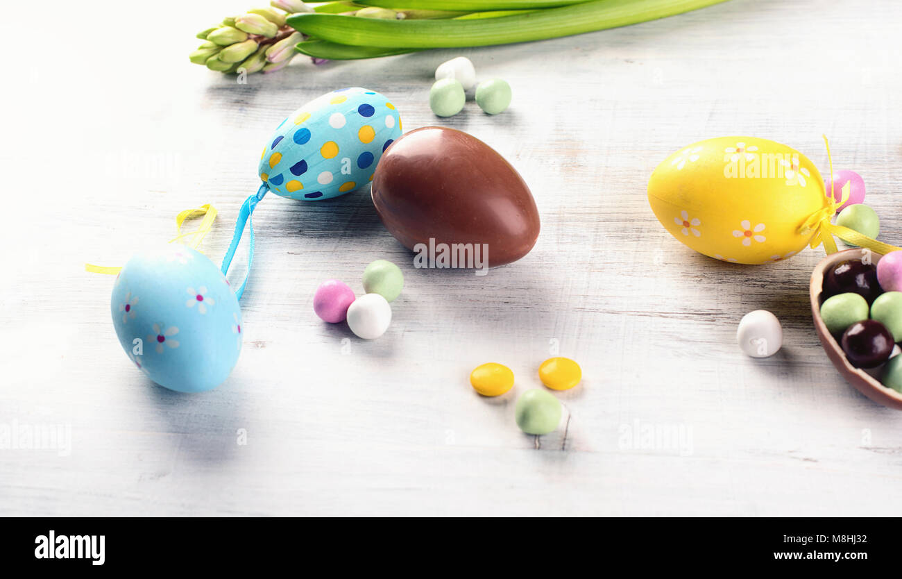 Easter eggs and spring flower on a white wooden background Stock Photo ...