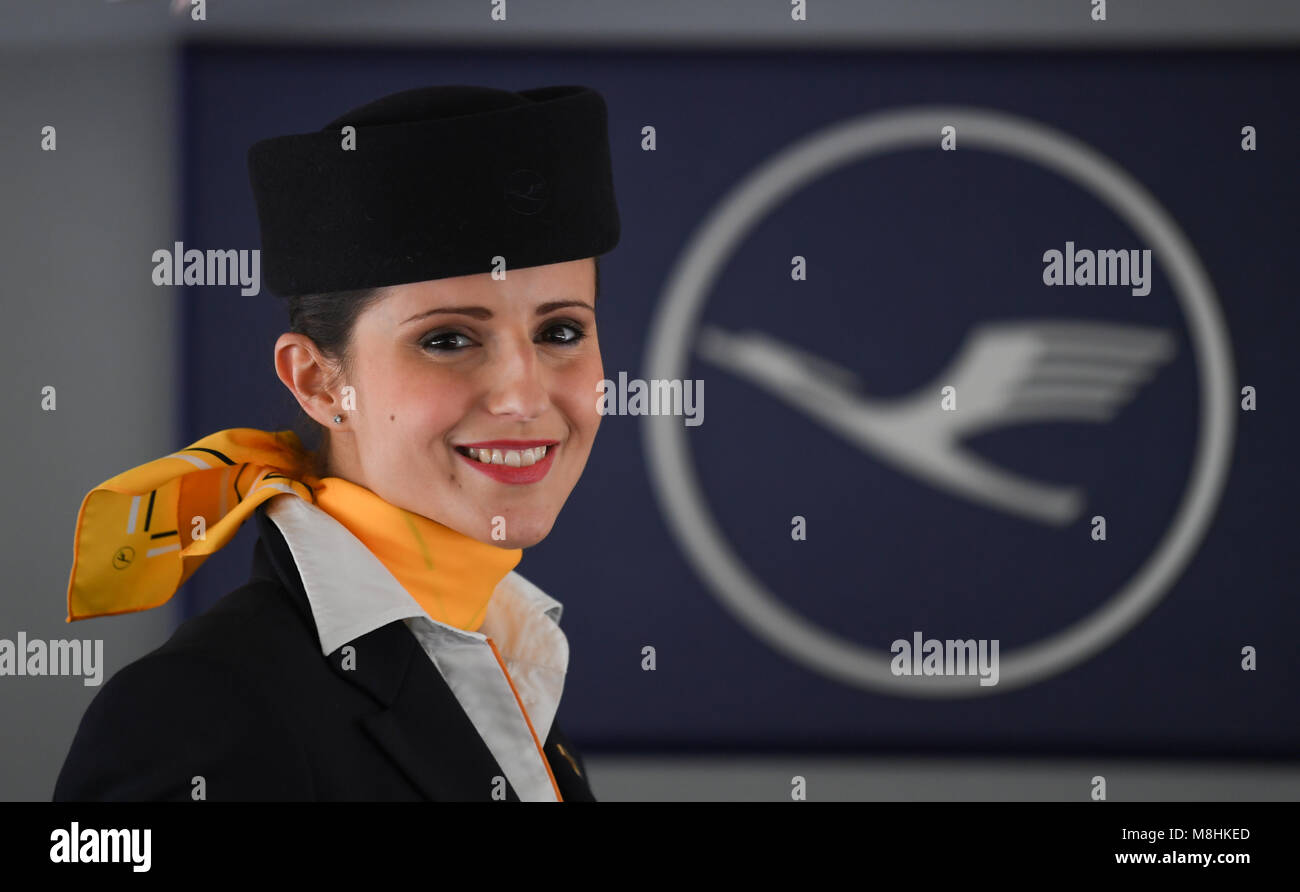 14 March 2018, Germany, Frankfurt: Flight attendant Natalie Reis smniles as  she stands in front of