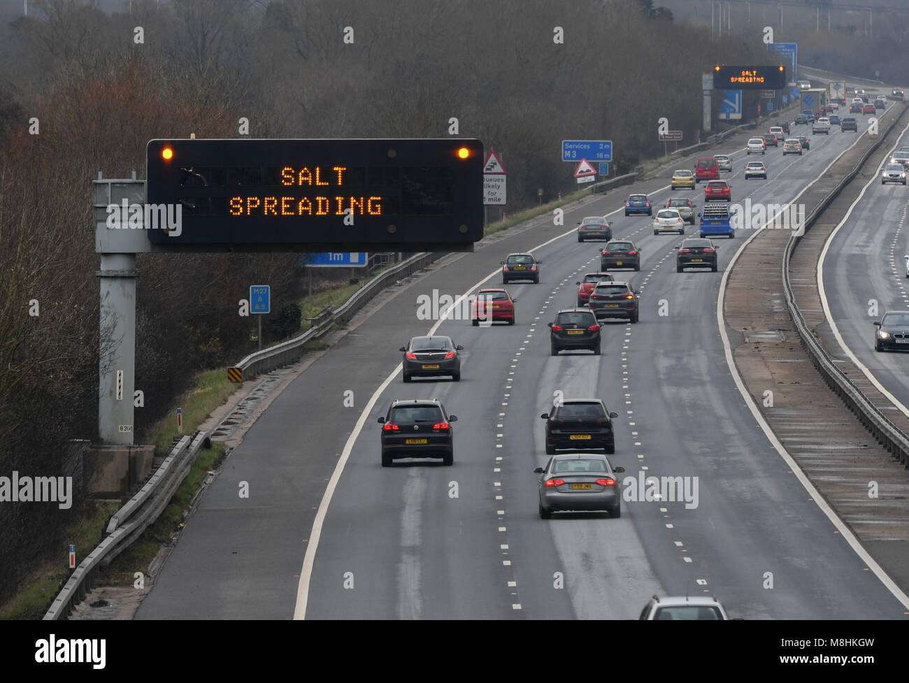 17th March 2018 Southampton UK weather. Salt spreading warning signs as the gritting trucks head out on the M27 motorway in Southampton, Hampshire, England as the country prepares for the visit of more severe weather named the mini beast from the east in the form of ice and snow. Credit: PBWPIX/Alamy Live News Stock Photo