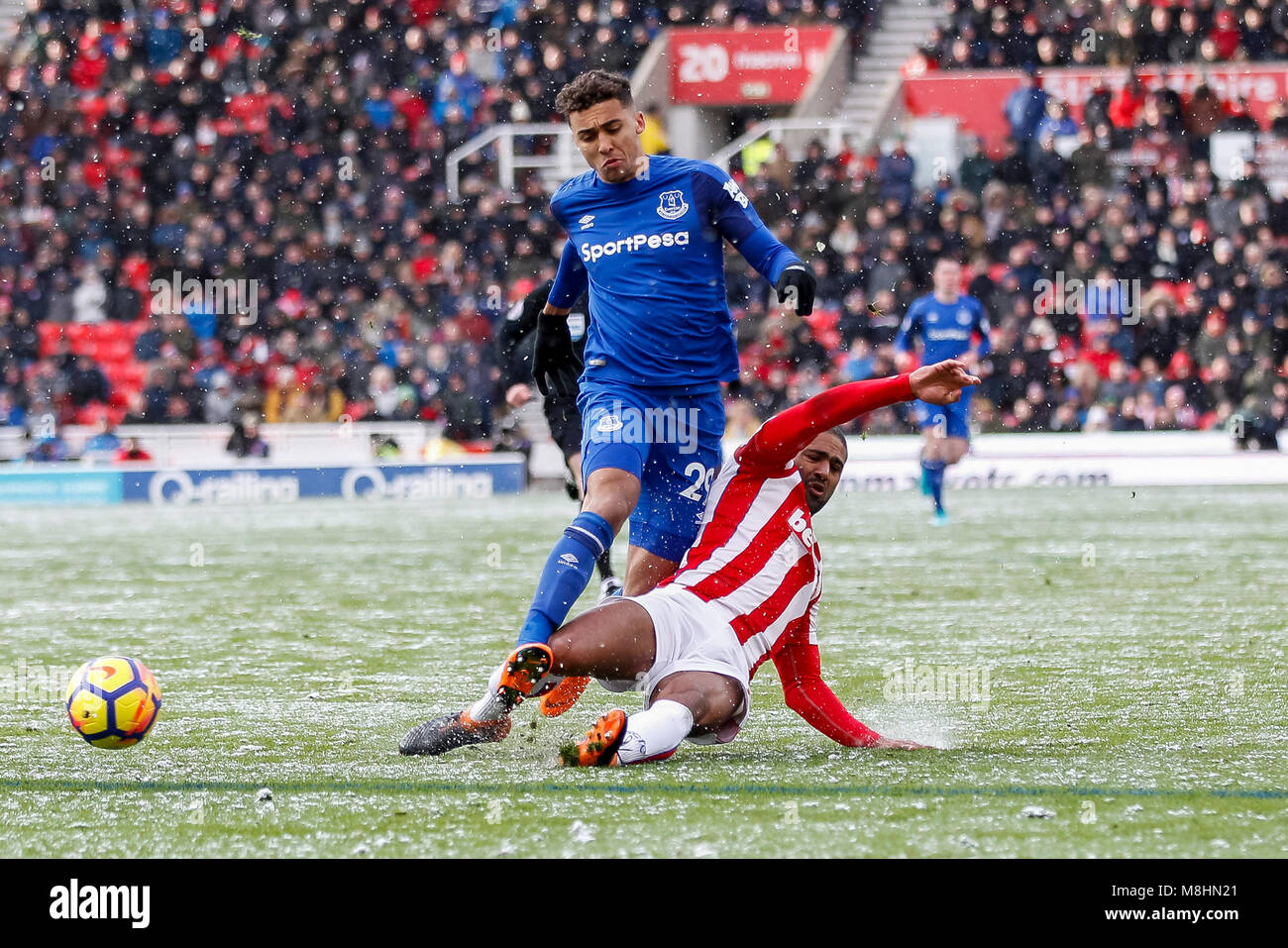 Dominic Calvert-Lewin of Everton and Glen Johnson of Stoke City during the Premier League match between Stoke City and Everton at Bet365 Stadium on March 17th 2018 in Stoke-on-Trent, England. (Photo by Daniel Chesterton/phcimages.com) Stock Photo