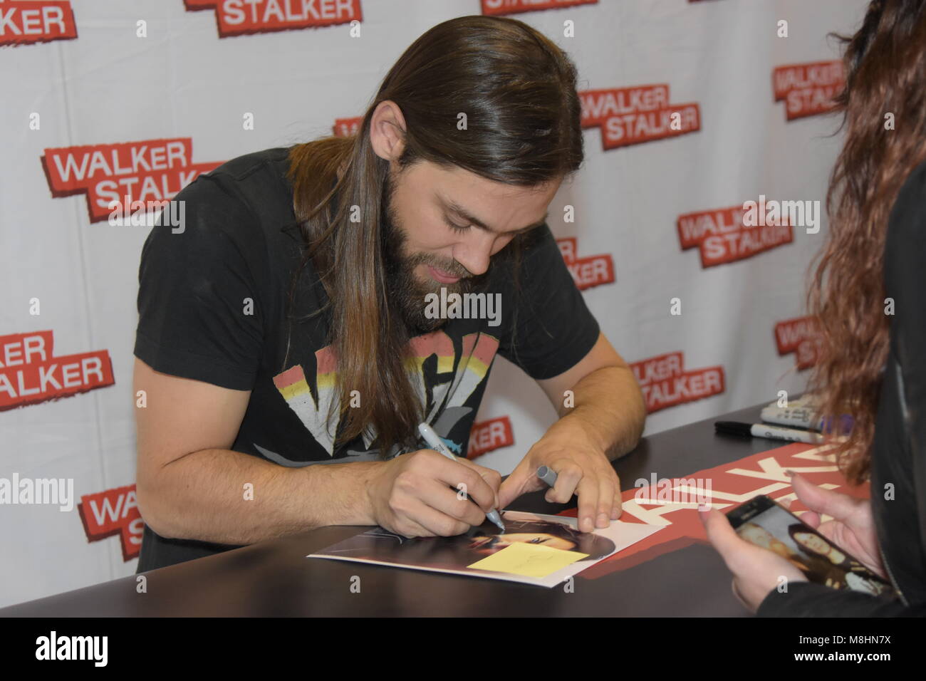 MANNHEIM, GERMANY - MARCH 17: Actor Tom Payne (Jesus on The Walking Dead) at the Walker Stalker Germany convention. (Photo by Markus Wissmann) Stock Photo