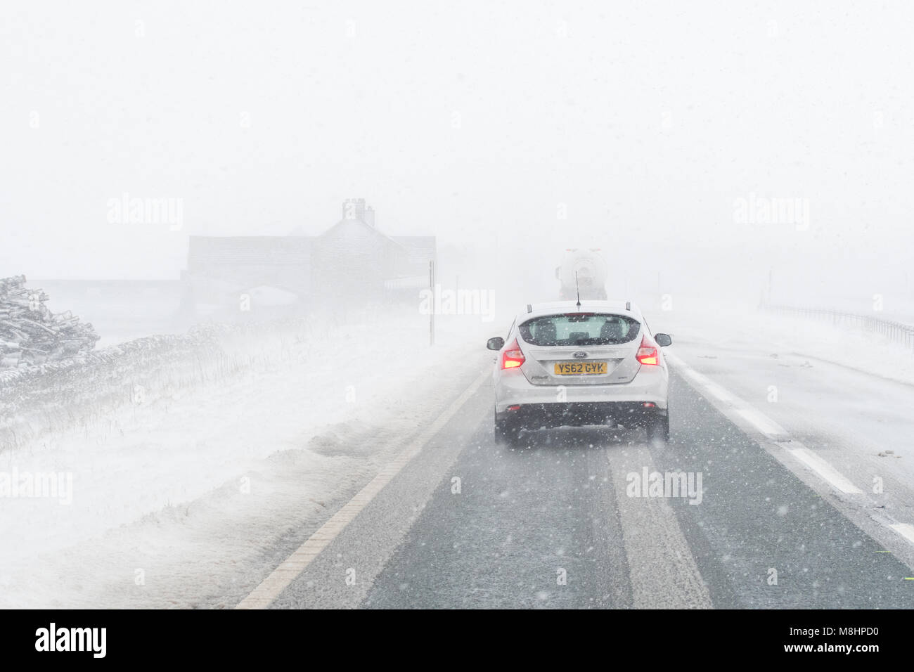 A66, 17 March 2018: UK weather - white out - heavy snow and icy conditions created very difficult driving conditions on the A66.  There were multiple acceidents and long tailbacks in both directions Credit: Kay Roxby/Alamy Live News Stock Photo