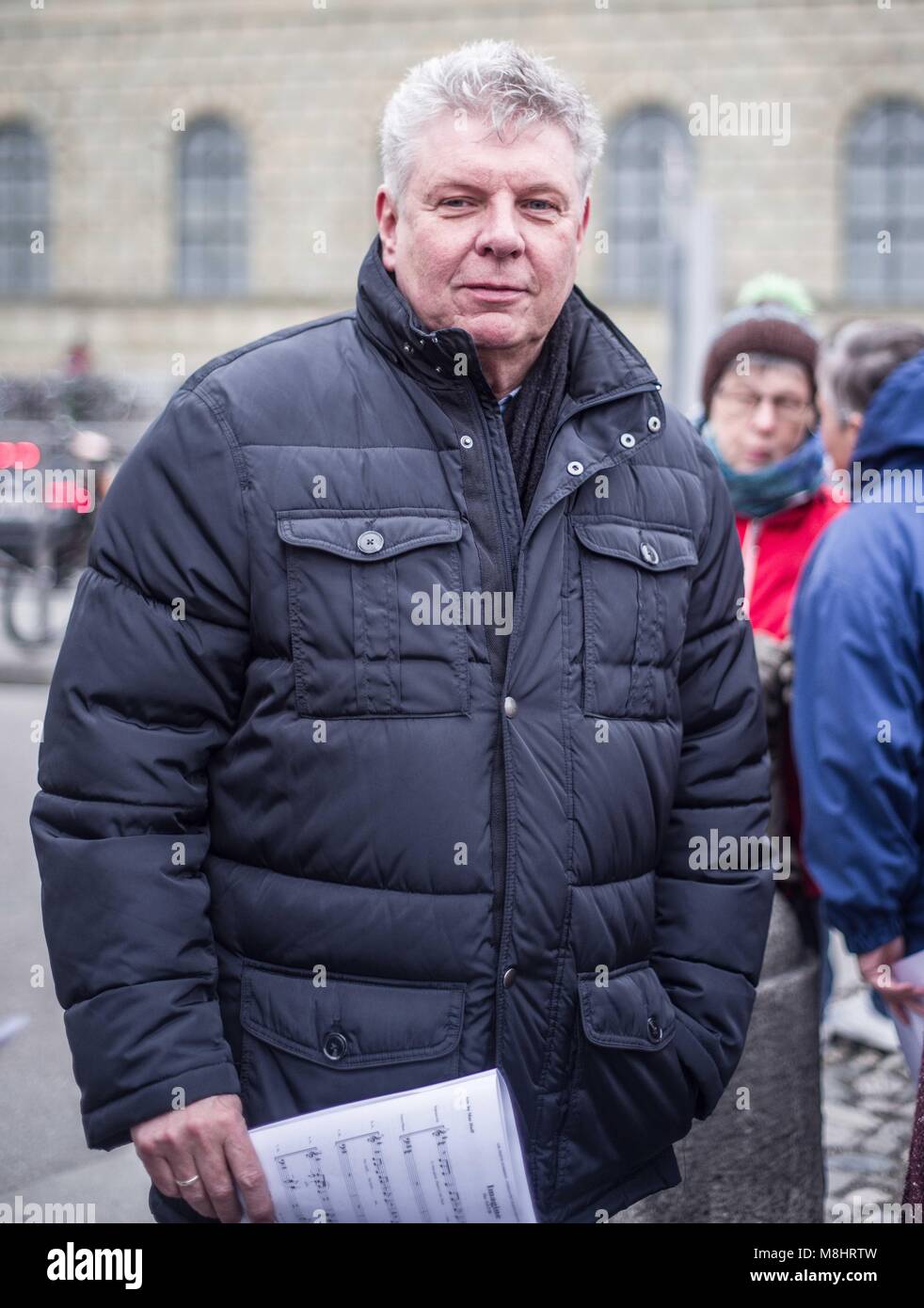 Munich, Bavaria, Germany. 17th Mar, 2018. Munich mayor Dieter Reiter. Protesting against the arrival of Pegida Dresden's Lutz Bachmann and Sigfried Daebritz in Munich, no less than three demonstrations were organized by the city, including a Muenchen ist Bunt and Bellevue di Monaco protest at Max Joseph Platz. At this demonstration, choirs were in attendance, along with celebrities, politicians, and other prominent Muenchners dressed as doctors in order to tell Pegida that they will help them go back to Dresden. Participants: Syrischer Friedenschor, MÃ¼nchner Kneipenchor, Der Chor der Sc Stock Photo