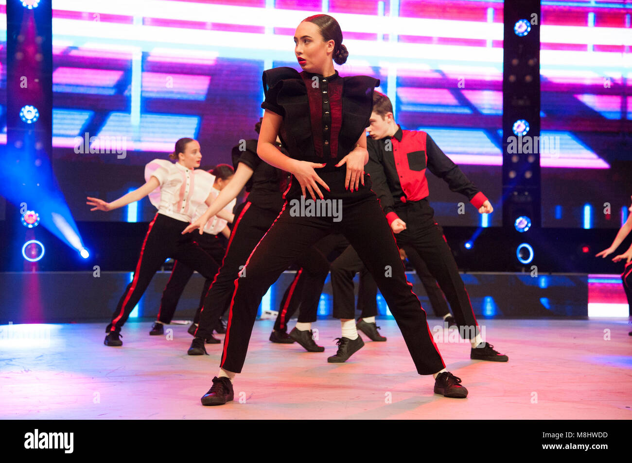 Move It 2018. HV Dance Collective perform on the main stage. Move It, the country's biggest dance event, takes place at ExCeL, London, UK. Running 16th-18th March 2018, the event is drawing large crowds of dance enthusiasts and students, with trade stands, workshops, showcases, and stunning performances by leading performing arts academies and dance groups taking place on the main stage throughout each day. 17th March 2018. Credit: Antony Nettle/Alamy Live News Stock Photo