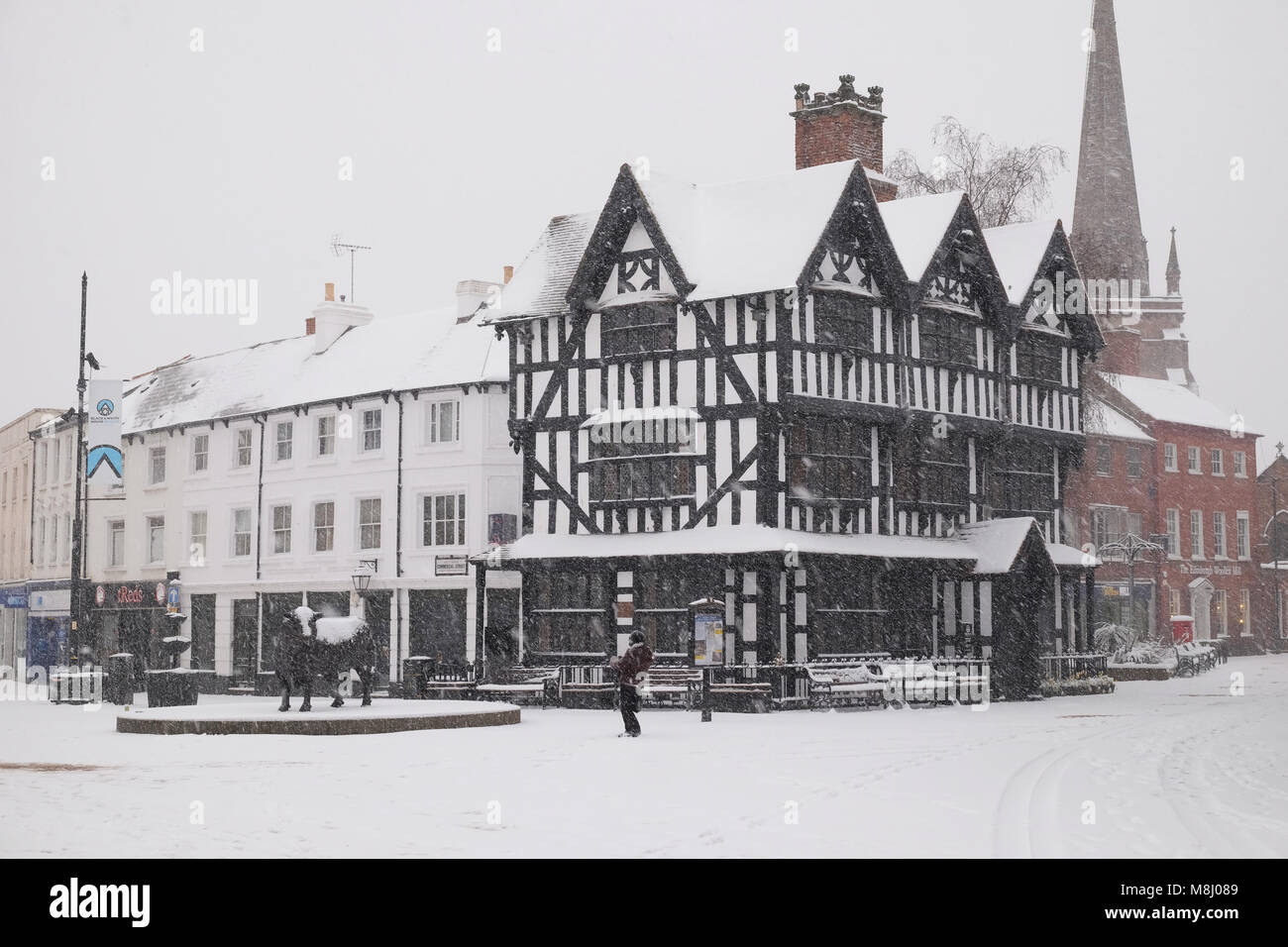 Hereford, Herefordshire, UK - Sunday 18th March 2018 - Hereford heavy snowfall overnight continues during Sunday morning  - the historic "Black and White House" dating from 1621 in the city centre High Town area covered in snow - Steven May /Alamy Live News Stock Photo