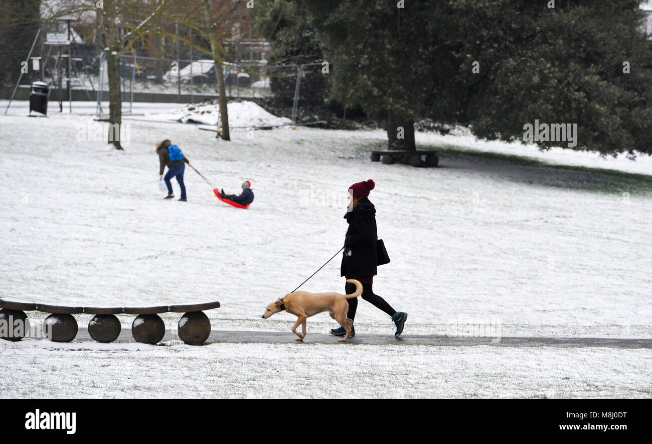 Brighton UK 18th March 2018 -  A snowy scene in Queens Park Brighton  today as a mini Beast from the East sweeps across Britain with more snow and cold weather forecast for the next few days Credit: Simon Dack/Alamy Live News Stock Photo