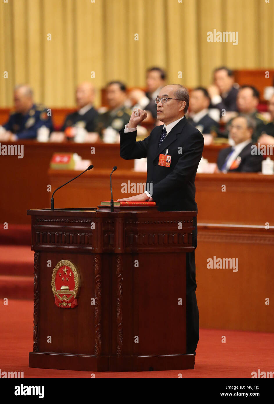 Beijing, China. 18th Mar, 2018. Zhang Jun takes an oath of allegiance