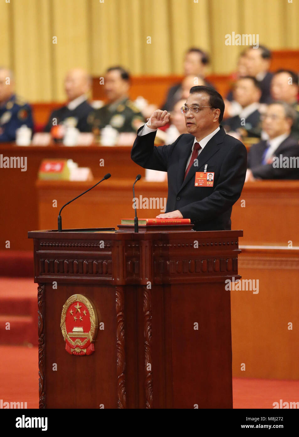 Beijing, China. 18th Mar, 2018. Li Keqiang takes an oath of allegiance to the Constitution in the Great Hall of the People in Beijing, capital of China, March 18, 2018. Li Keqiang was endorsed as Chinese premier Sunday at the ongoing first session of the 13th National People's Congress (NPC), the country's national legislature. Credit: Yao Dawei/Xinhua/Alamy Live News Stock Photo