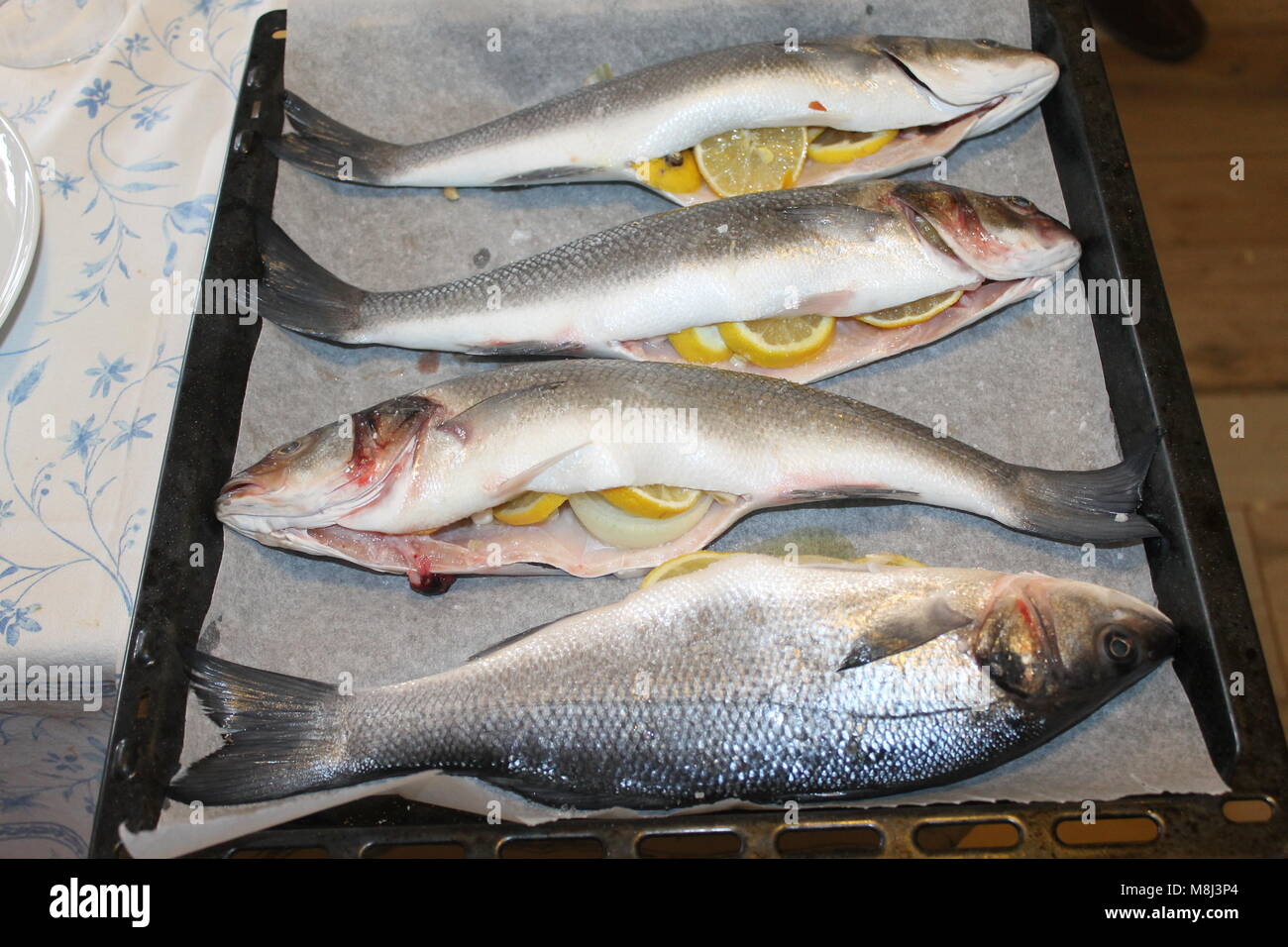 preparation of sea bass stuffed with lemon Stock Photo Alamy