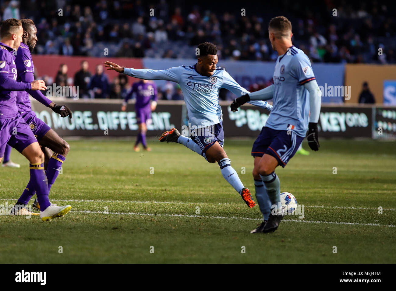 NYCFC vs. Orlando City SC action at Yankee Stadium on 17th March 2018. NYCFC won 2-0. Rodney Wallace (23) takes a shot. Stock Photo