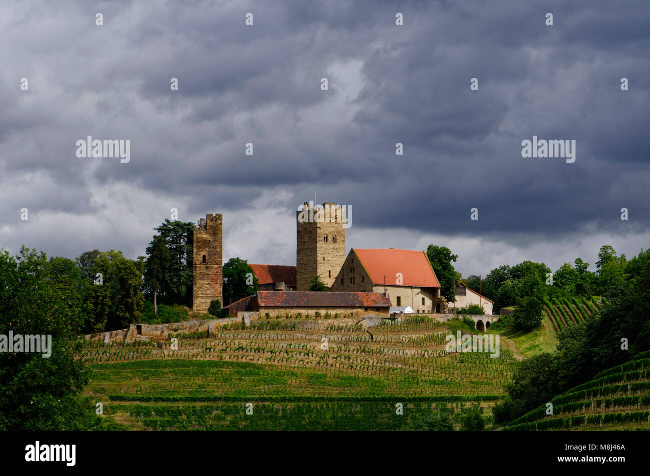 Neipperg: Rainclouds over Neipperg Castle, surrounded by vineyards, near Brackenheim, Heilbronn District, Baden-Württemberg, Germany Stock Photo