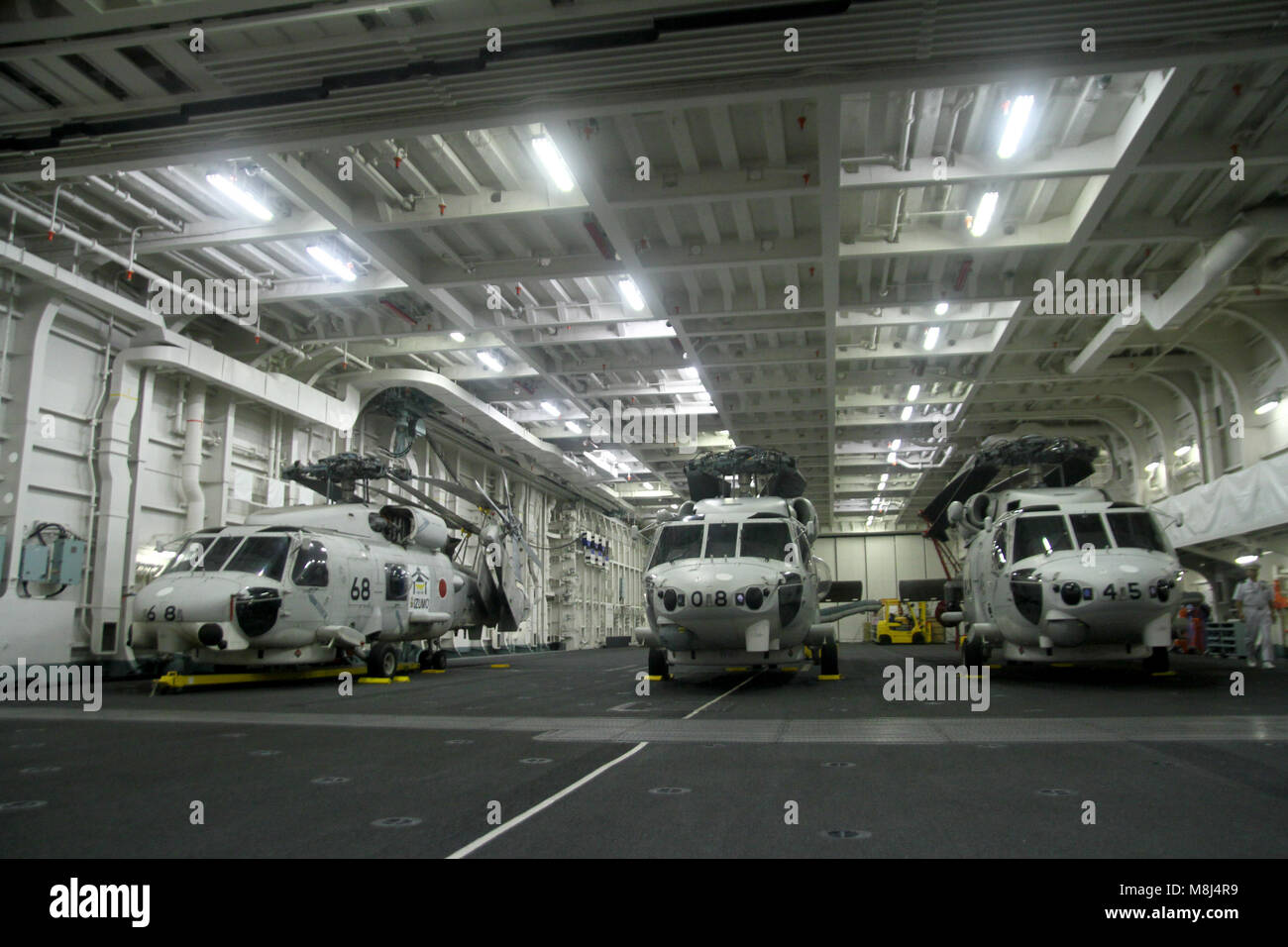 Inside Helicopter carrier Izumo's hangar bay Stock Photo