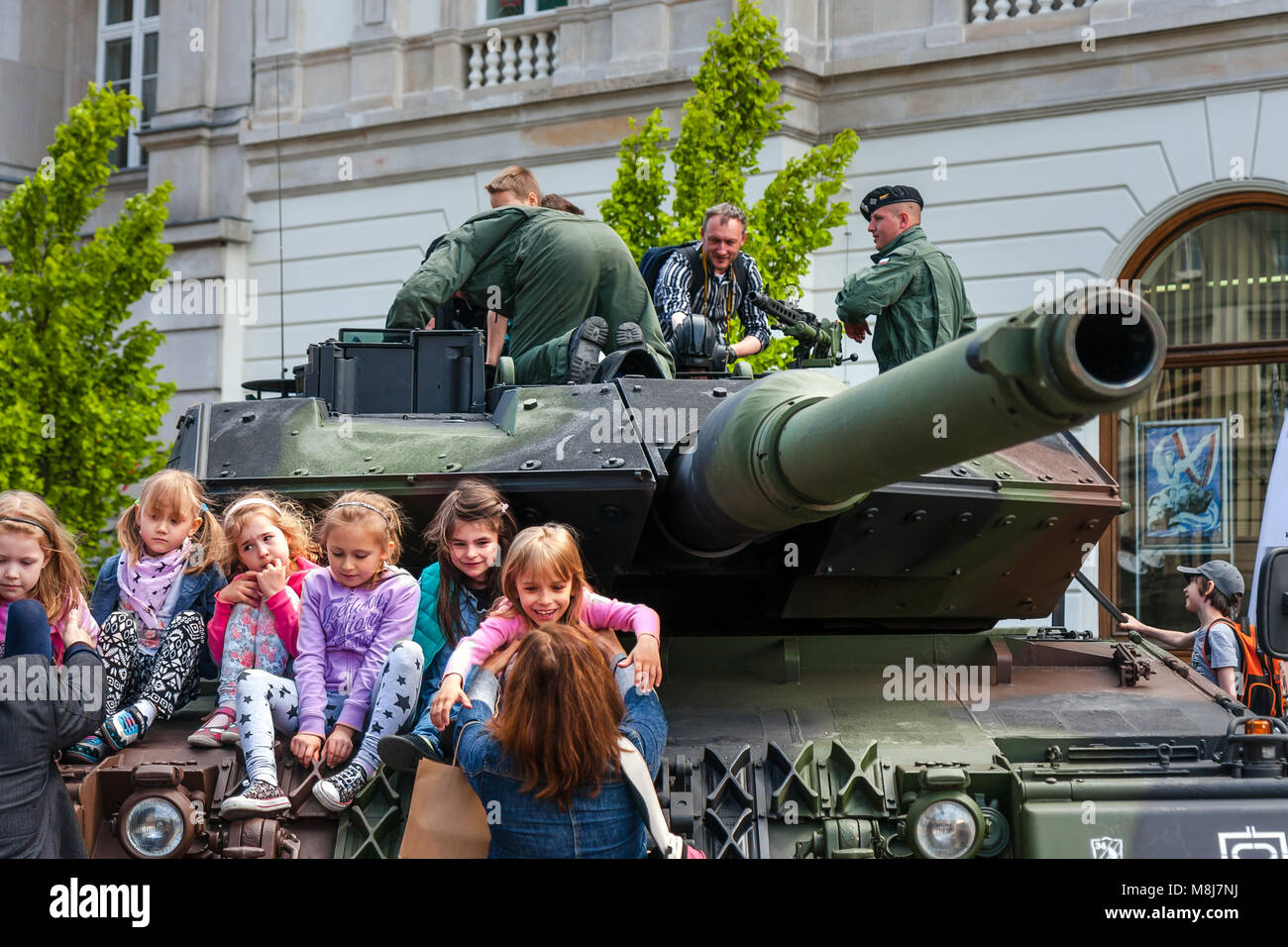 WARSAW, POLAND - MAY 08, 2015: Leopard 2 tank and children learning about army, during the public celebrations of 70th Anniversary of End of WW II Stock Photo