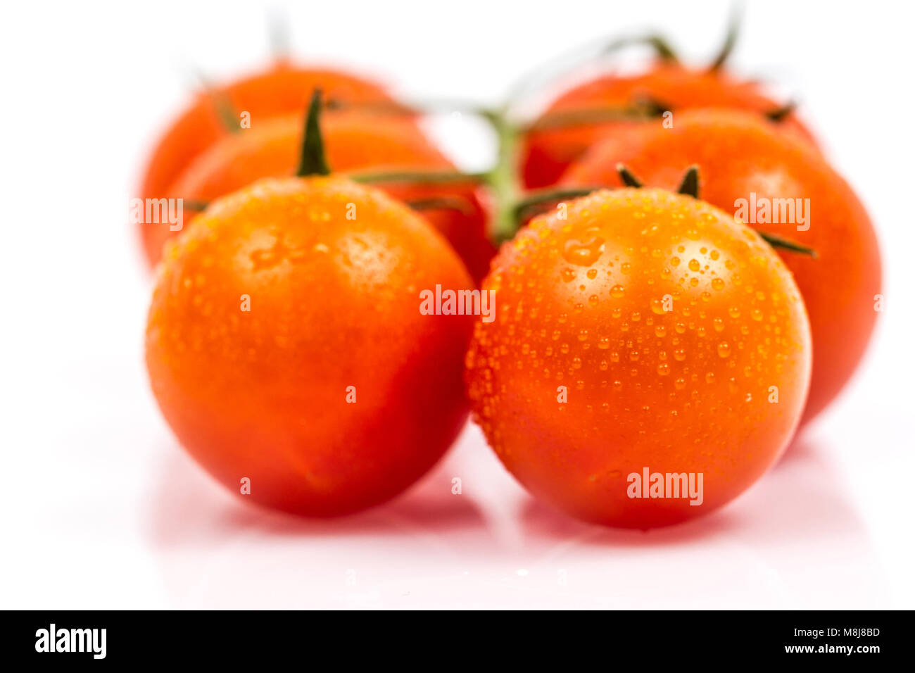 Tomato with water drops isolated on white background Stock Photo - Alamy