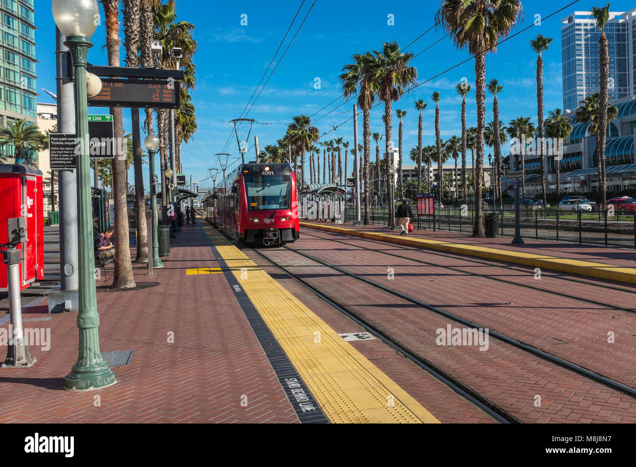 SAN DIEGO, CALIFORNIA, USA - Red Line Trolley approaching the Gaslamp Quarter Station located in the downtown Gaslamp Quarter of the city. Stock Photo