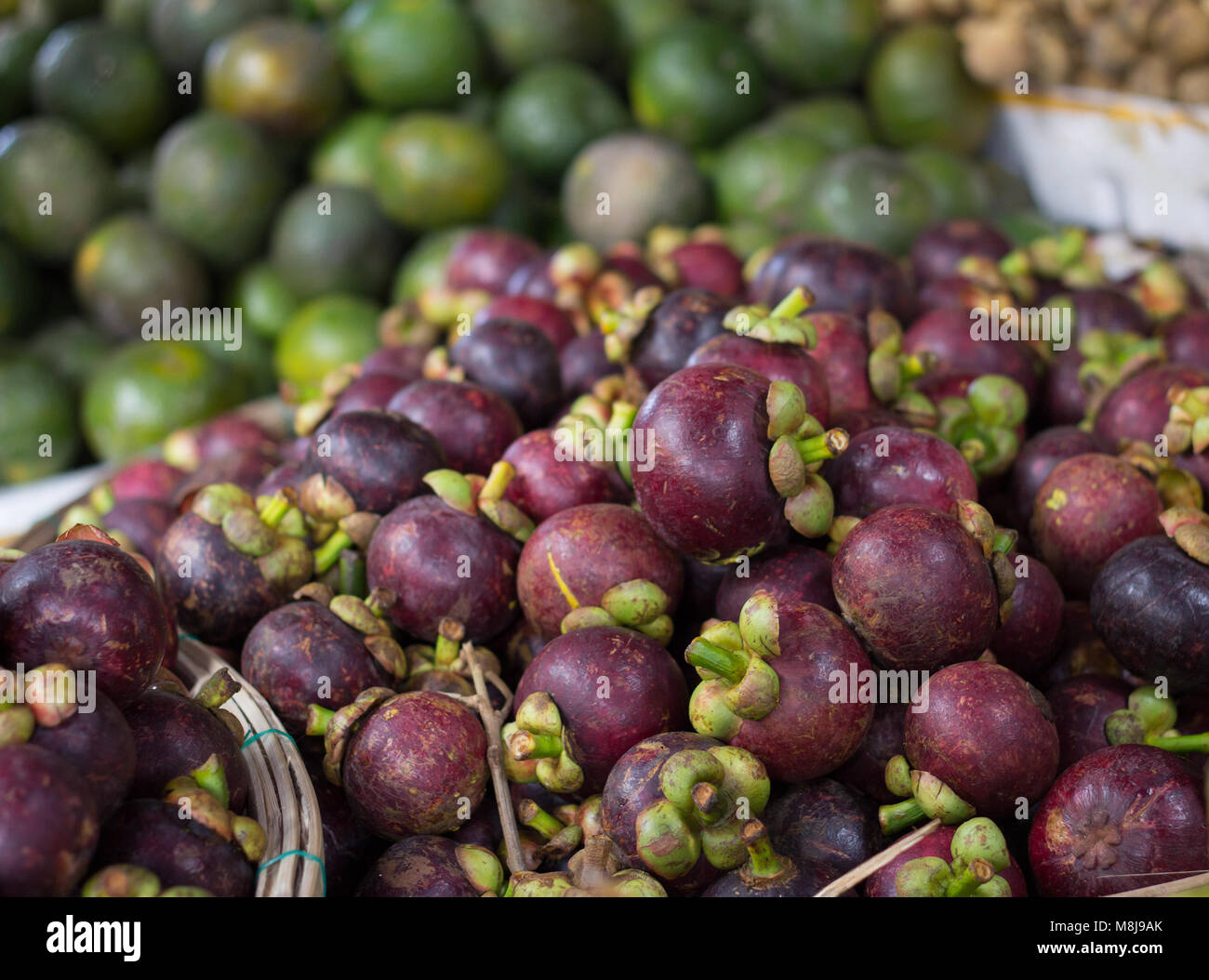 pile of mangosteen fruit on market Stock Photo