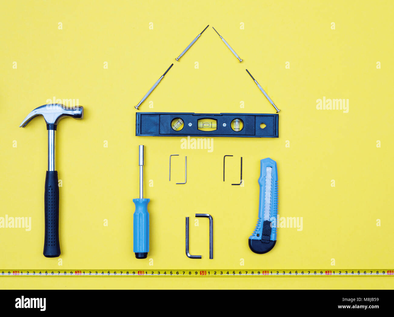 Selection of tools in the shape of a house home improvement concept on ...
