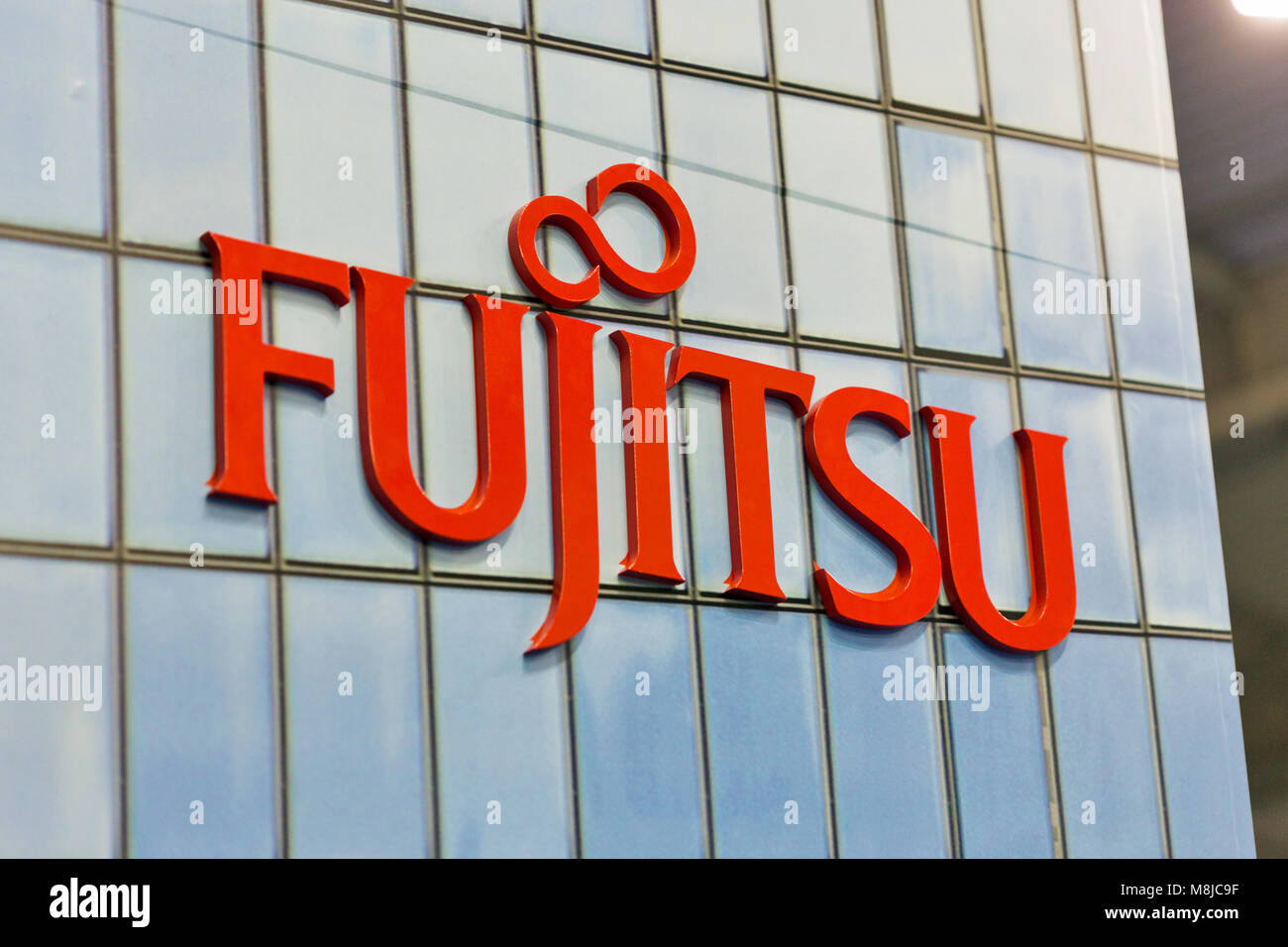 KIEV, UKRAINE - OCTOBER 07, 2017: Logo Fujitsu closeup, a Japanese multinational information technology equipment and services company booth at CEE 20 Stock Photo