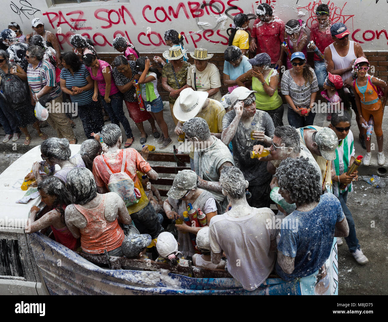 View from above of revellers and onlookers covered in flour in the Carnival de Negros y Blancos in Popayán Stock Photo