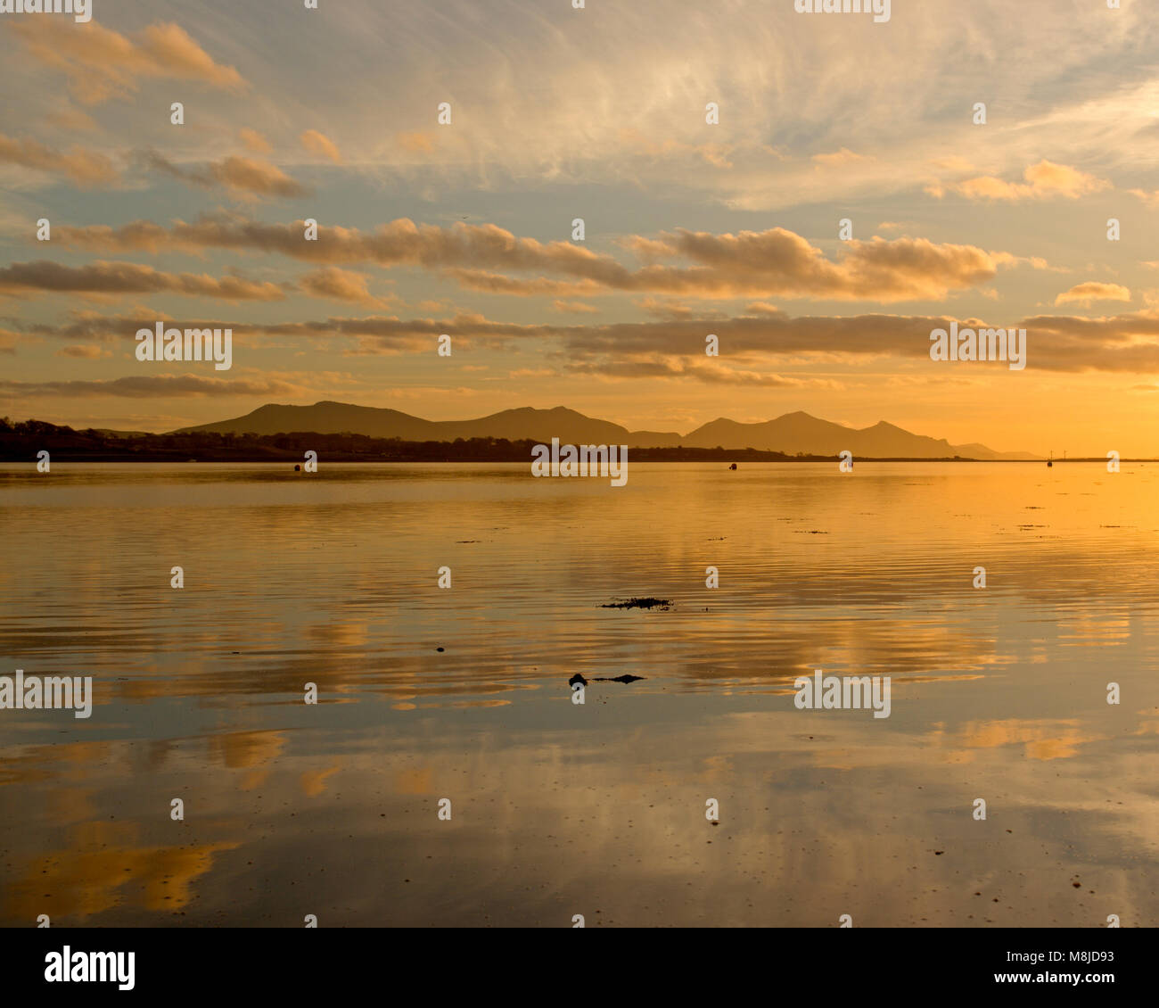 Llyn Peninsula and the Menai Straits at sunset, Anglesey, North Wales coast Stock Photo