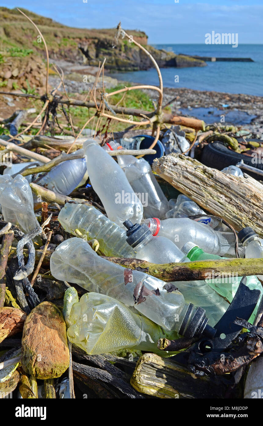 discarded plastic waste washed up on the beach at trabolgan on the southwest coast of ireland. Stock Photo