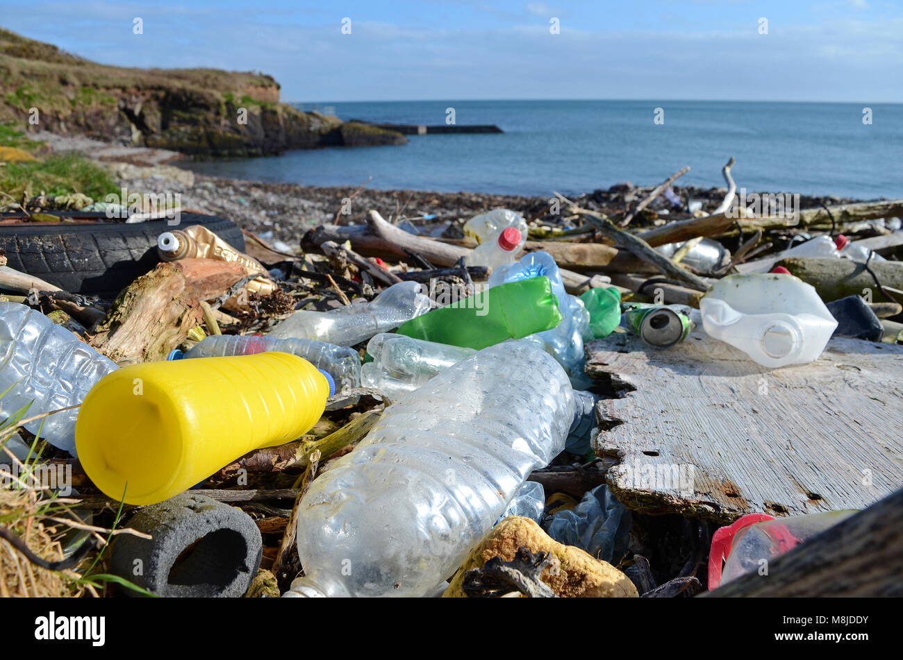 discarded plastic waste washed up on the beach at trabolgan on the