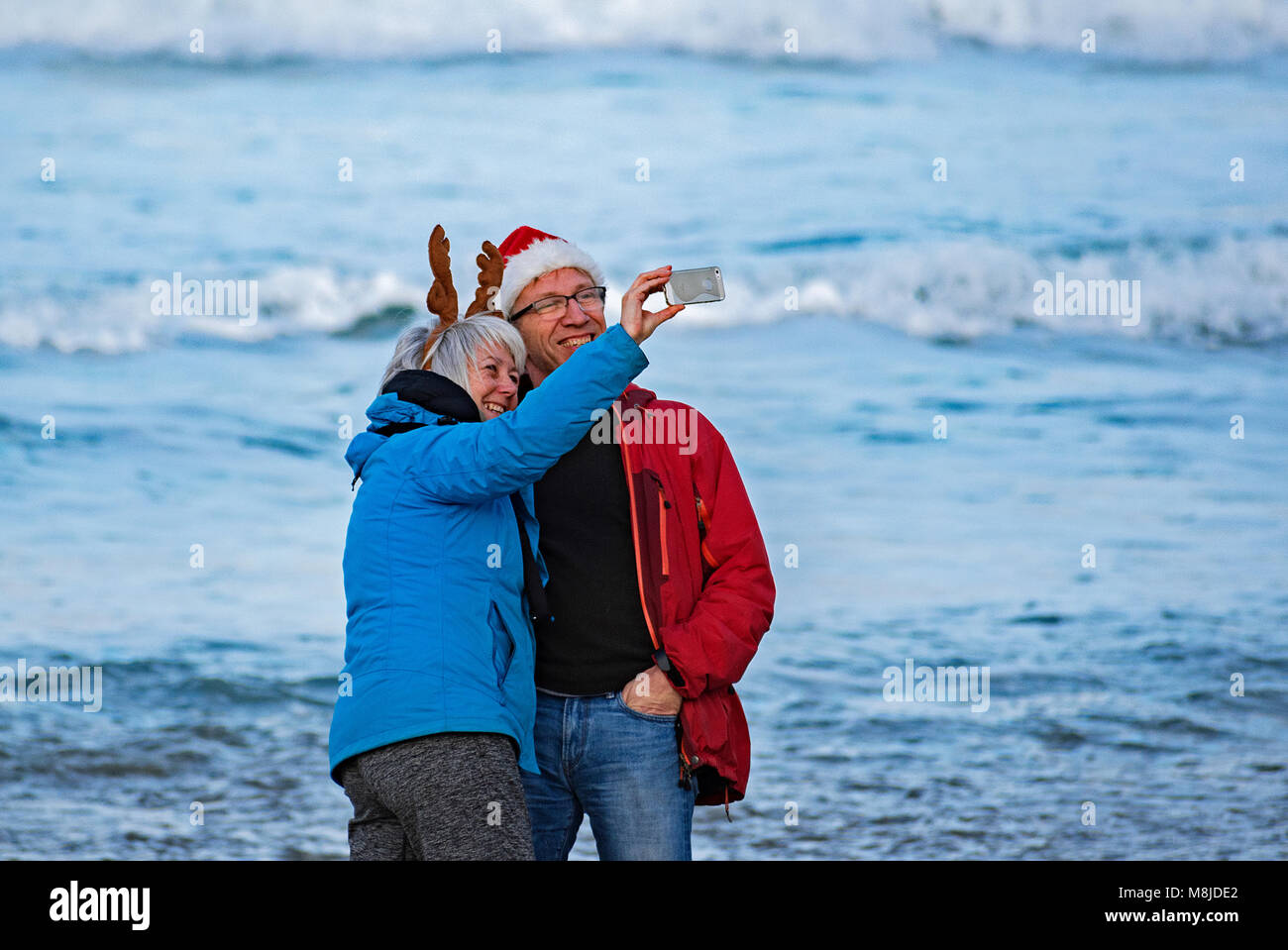 middle age couple taking a selfie at the coast Stock Photo