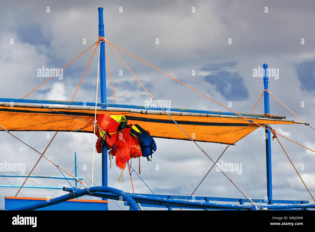 Life vests hanging under canvas awningbalangay or bangka double