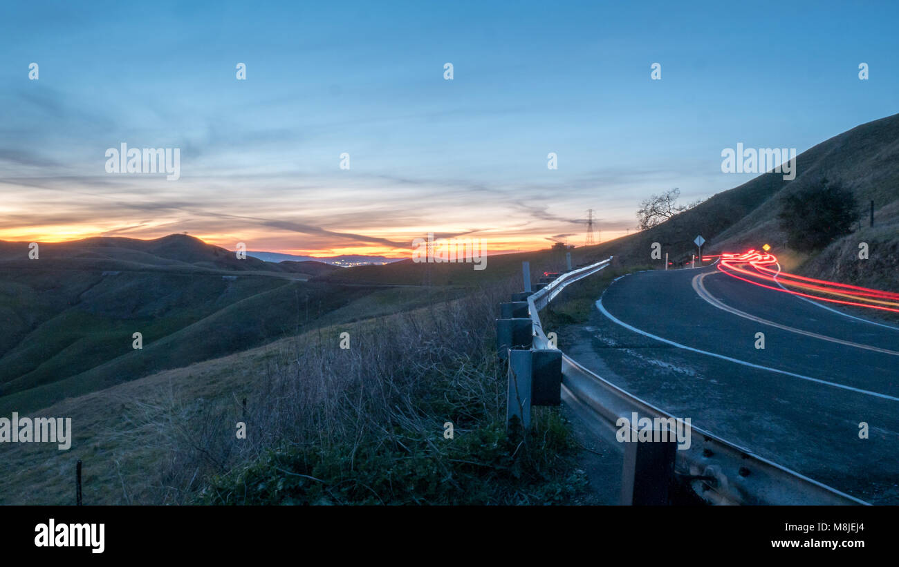 Long Exposure Picture of Cars in Mountains Roads at Sunset Stock Photo ...