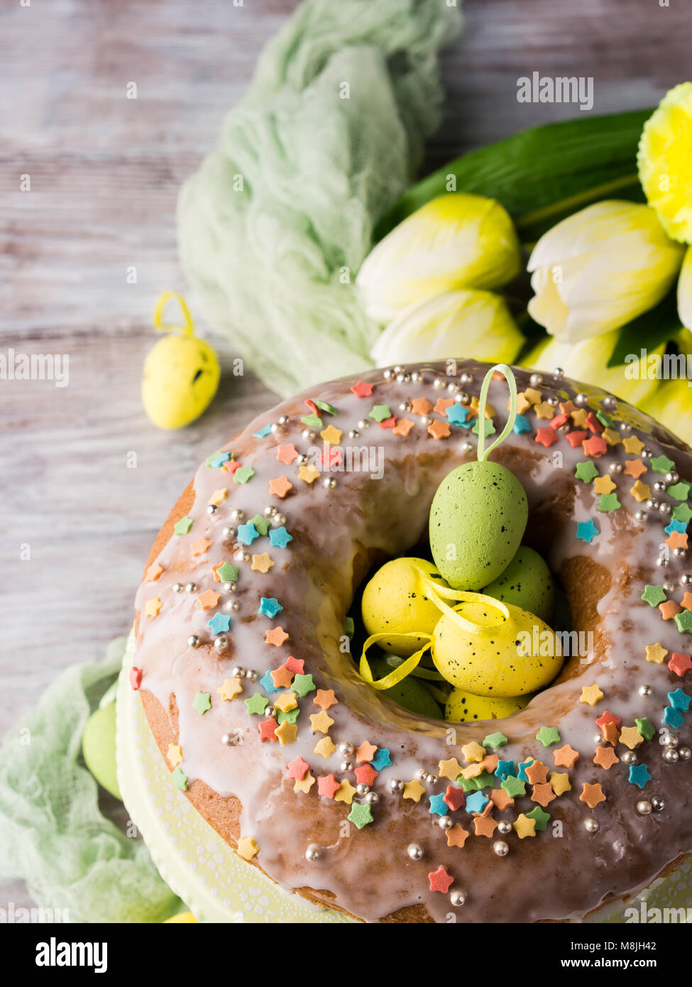 Easter ring cake with decorative festive eggs and sprinkles Stock Photo ...