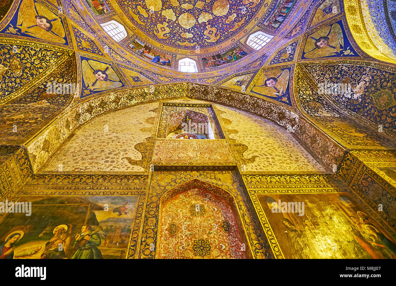 ISFAHAN, IRAN - OCTOBER 20,2017: The wall of Armenian Orthodox Bethlehem Church in New Julfa is covered with murals and fine floral golden patterns, o Stock Photo