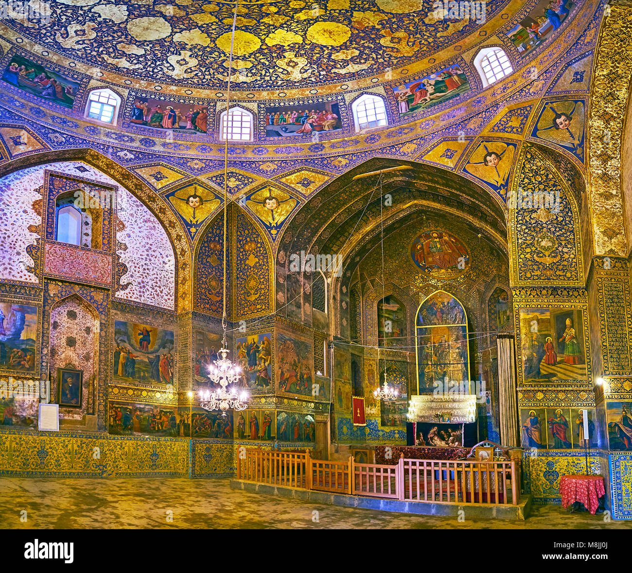 ISFAHAN, IRAN - OCTOBER 20,2017: Panorama of Armenian Orthodox Bethlehem Church with altar and side walls decorated with golden patterns and colorfed  Stock Photo