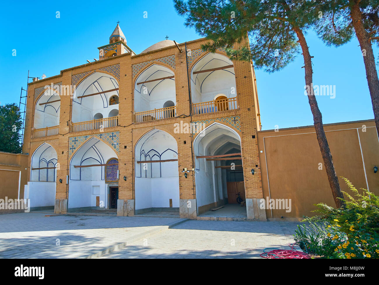 The facade of medieval Bethlehem Church, located in New Julfa Armenian neighborhood, building is decorated with white niches and tiled patterns, Isfah Stock Photo