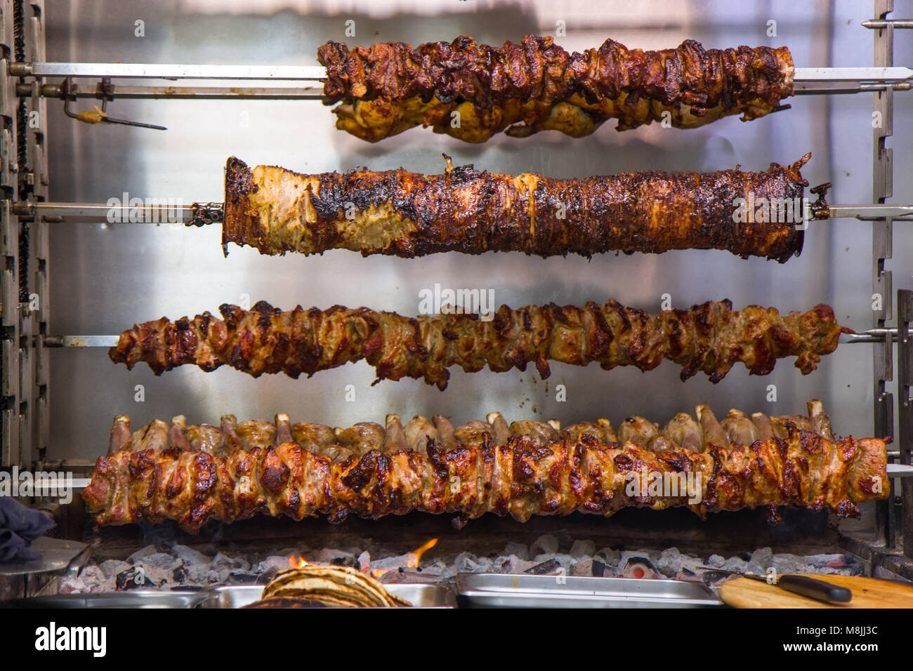 Traditional Greek cuisine on the rotating grill Stock Photo Alamy