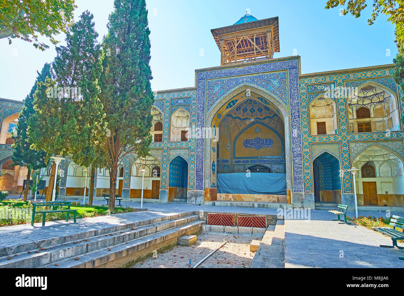 The beautiful garden of Chaharbagh madraseh with a view on the old ...