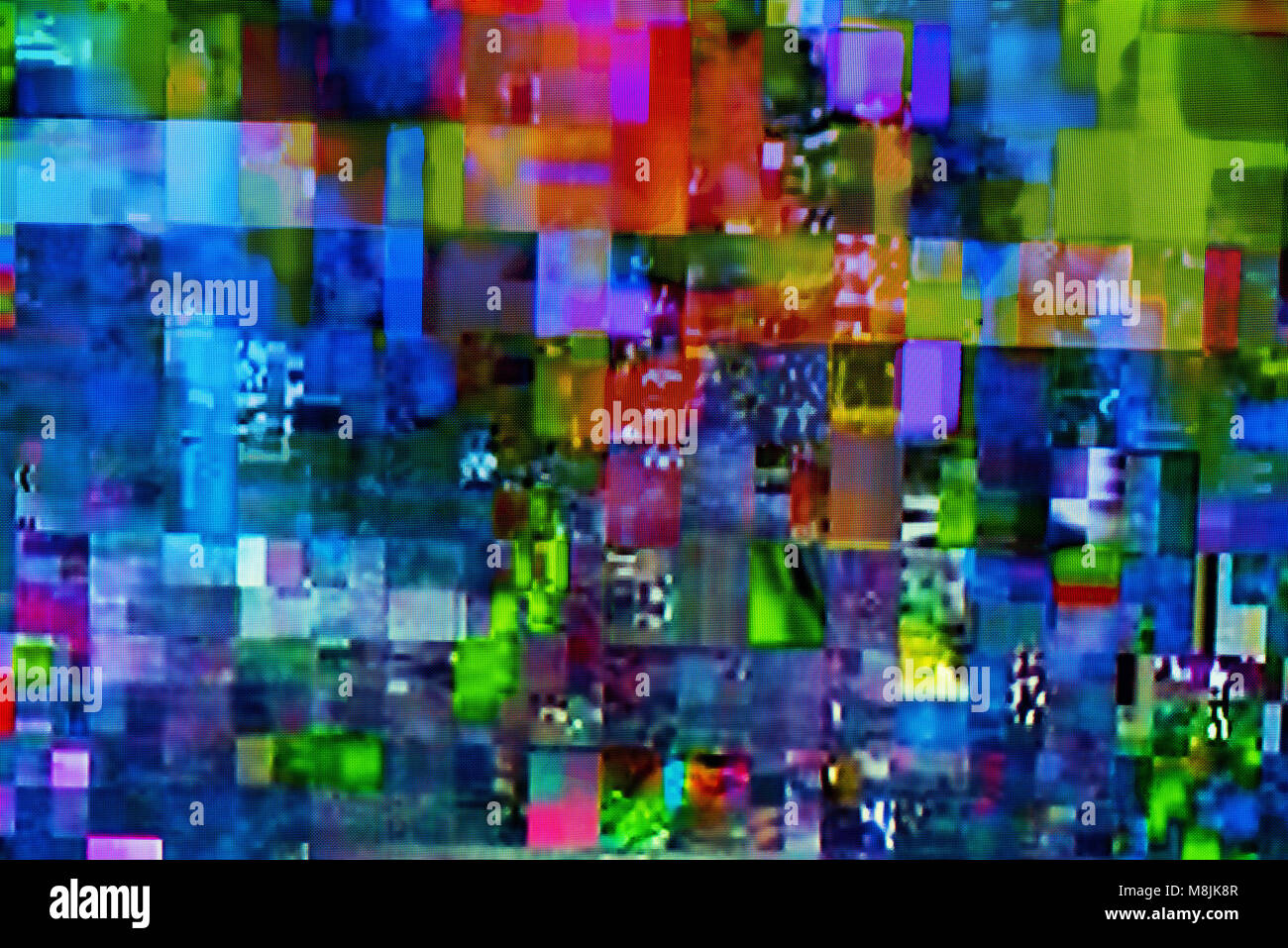 Digital TV glitch on television screen with misplaced squares, static effects and freezing problems during broadcast failure Stock Photo